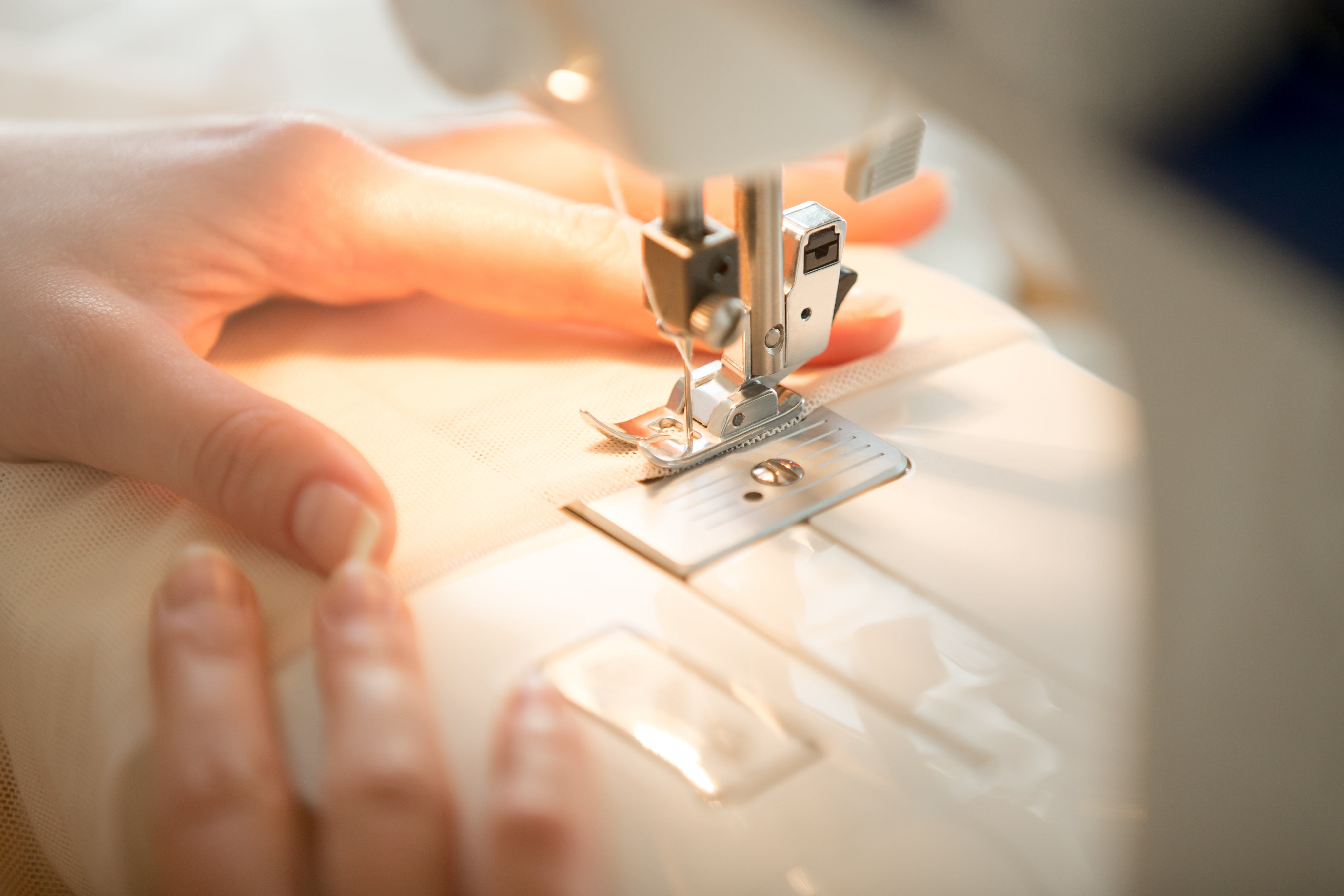 hands-sewing-machine.jpg